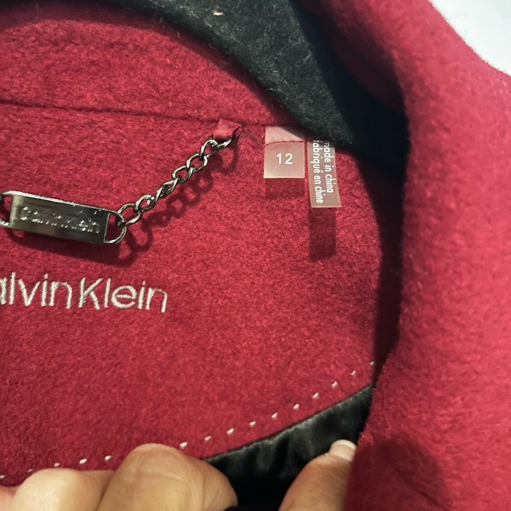 Wool coat, calf length. Worn twice on business trip.